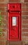 Victorian post box mounted in red brick column