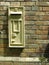 Victorian postbox in a brick wall