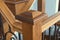 Victorian style staircase wood newel post haindrail brown metal baluster close-up