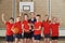Victorious School Sports Team With Trophy In Gym