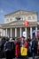 Victory Day celebration in Moscow. Red flag waves above people.