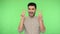 Victory! Extremely happy, joyous funny man showing double v finger gesture or peace symbol. green background, chroma key