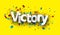 Victory sign over colorful cut out foil ribbon confetti background