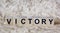 VICTORY word made of brown wooden letters