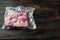 Vide sous vacuum beef brisket food, on old dark  wooden table background, top view flat lay , with copyspace  and space for text