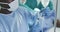 Video of african american male surgical assistant preparing drip during operation in theatre