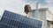 Video of african american man holding solar panel