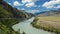 Video of Altai natural landscape with river Katun under blue sky with clouds. On the left bank of the river there is Chuya Highway