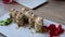 The video an assortment of Japanese sushi rolls, showcasing the exquisite combination of fresh fish and rice. The vibrant and