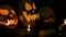 Video background for halloween. Three pumpkins with candles