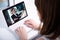 video blog concept - young woman watching business video on laptop