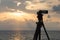 Video camera or camcorder recording the Beach at Sunset on sea