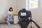 Video camera filming how woman using dehumidifier cleaning and drying air next to a bad mildew and fungus growth on an interior