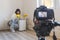 Video camera filming how woman using dehumidifier, solving the problem a toxic mold and mildew