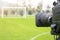 Video camera put on the back of football goal for broadcast on TV sport channel. football program can `t editing in studio