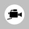 Video camera round icon. Black silhouette in white circle. Isolated vector symbol.