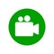 Video camera round icon. White silhouette in green circle. Isolated vector symbol.