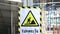 Video A caution construction danger sign in front of blur building site