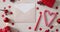 Video of christmas decorations with presents and envelope on wooden background