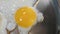 Video close up cooking one fried sunny side up egg in silver metal pan