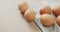 Video of close up of eggs and on rustic cloth on beige background