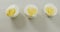 Video of close up of three halves of hard boiled eggs on grey background