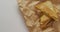Video of close up of toasted cheese sandwiches on brown paper over grey background