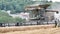 Video of combined harvester threshing machine cutting, harvesting corn Rotherham South Yorkshire UK