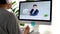 Video conference, Work from home, Asian man holding business chart while making video call to business team with virtual web,