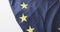 Video of creased flag of european union lying on white background