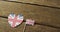 Video of flags of great britain in shape of heart and rectangle on wooden background