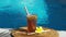 Video footage of glass with iced tea, cold with ice cubes and slices of lime, bamboo straw