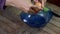 Video footage, hand egg shell breaking with stainless steel knife and then drop it into blue glass bowl