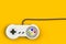 Video game console GamePad. Gaming concept. Top view retro joystick isolated on yellow background