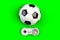 Video game console GamePad. Gaming concept. Top view retro joystick with soccer ball isolated on green background