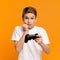 Video games addicted teenager emotionally losing with joystick