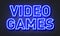 Video games neon sign on brick wall background.