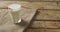 Video of glass of fresh milk on wooden background