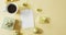 Video of gold christmas decorations with coffee and presents on yellow background
