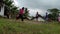 Video of a group of Asian children playing in a field, they look happy