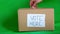 video of a hand putting a ballot into a ballot box to vote. chroma background