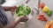 Video of hands of asian woman washing vegetables