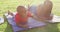 Video of happy african american son and father doing plank on grass and doing high five