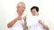 Video Happy Asian senior couple holding white blank sign ready for promotion advertising banner