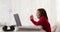 Video of happy biracial girl having online lessons