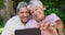 Video of happy biracial senior couple taking selfie in garden