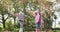 Video of happy caucasian brother and sister having fun throwing autumn leaves in garden