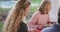 Video of happy caucasian mother turning and smiling at outdoor family dinner table