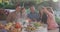 Video of happy caucasian parents, daughter and grandparents taking selfie at outdoor dinner table