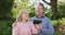 Video of happy caucasian senior husband and wife making video call on smartphone in garden